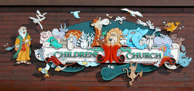 Sign on the side of the Ark: Those are flies buzzing around Noah's shovel!